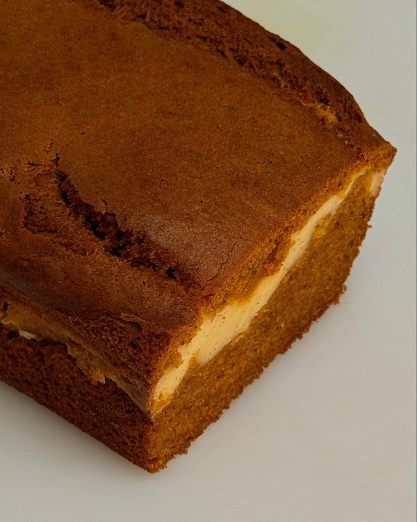 image of the bad ash bakes pumpkin loaf with the cheesecake swirl in the middle.